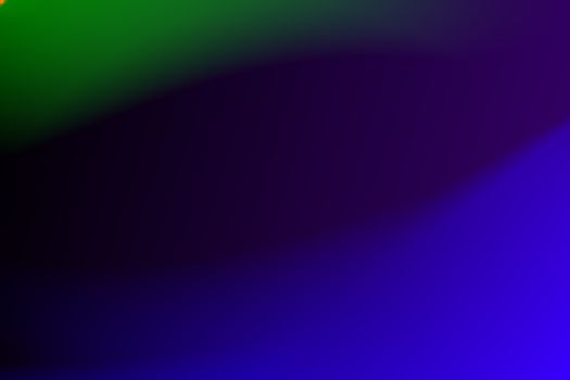 Vibrant abstract gradient background featuring purple, blue, and green colors.