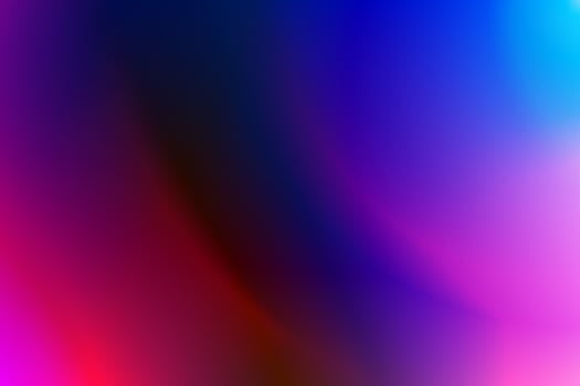 A vivid abstract gradient featuring bold pink, purple, and blue hues.