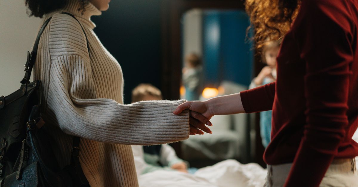people standing in a circle having a respectful discussion with diverse ages and backgrounds, warm lighting
