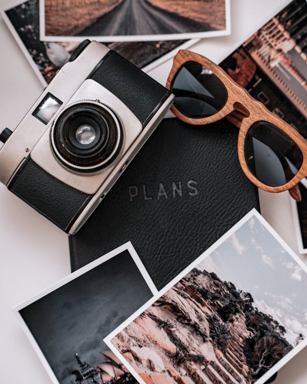 Black and Silver Camera on White and Brown Book · Free Stock Photo