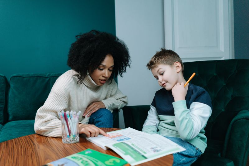 A teacher guiding a student through a structured lesson