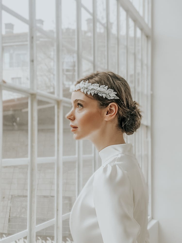 Dreamy Elegant Woman In Hairband Near Windows