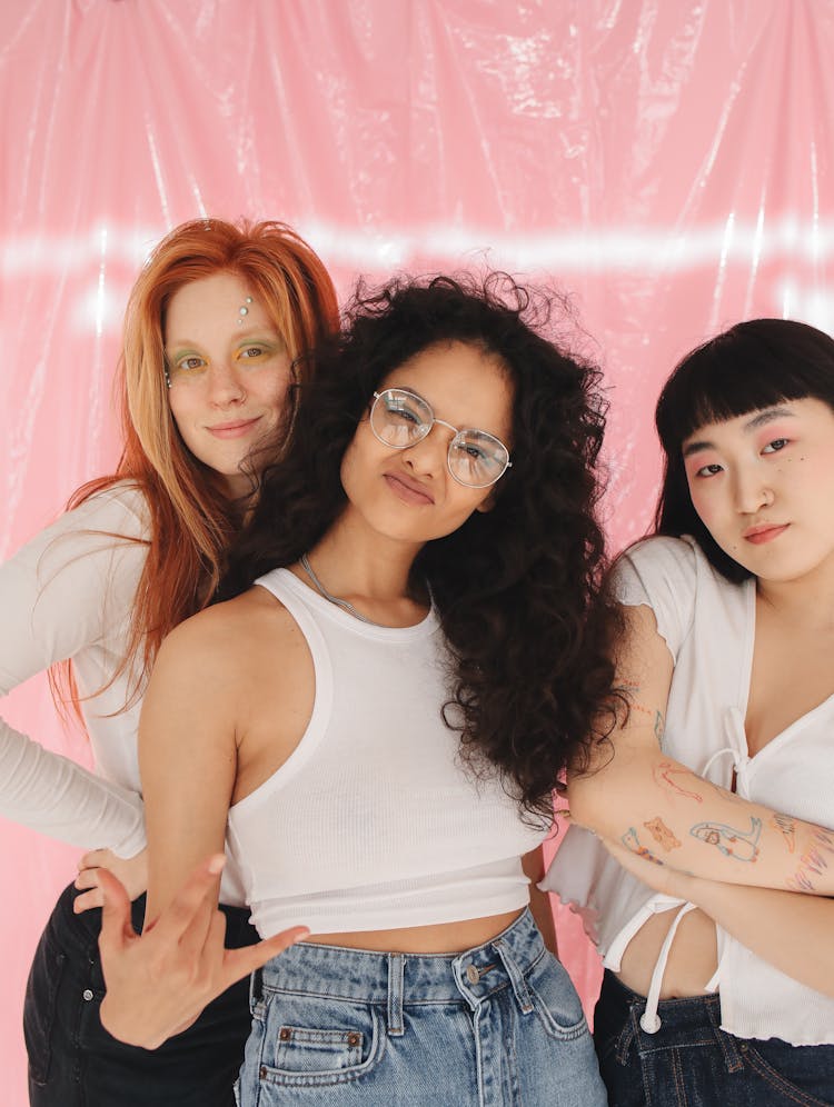 A Group Of Young Girls Smiling While Wearing White Tops