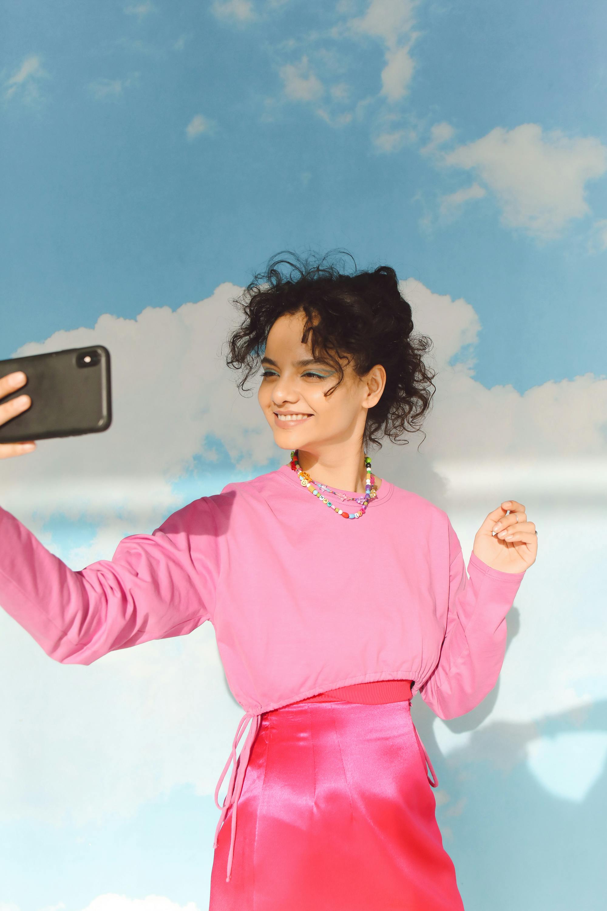 photo of a woman holding a mobile phone