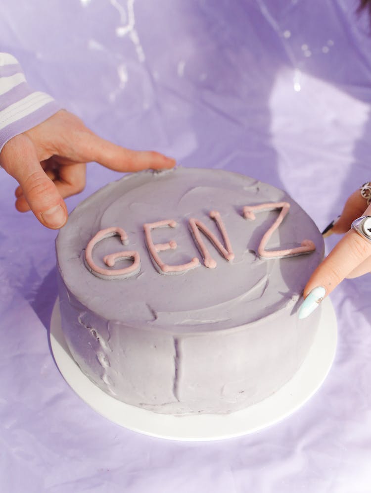 People Touching A Minimalist Cake