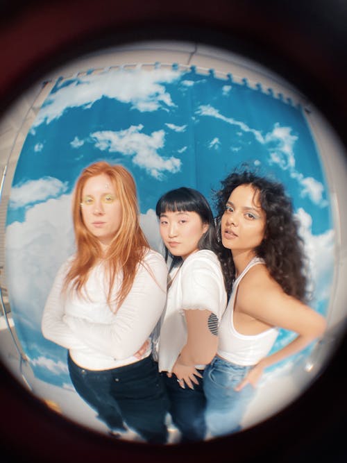 Fisheye Photo of Three Girls Posing and Looking at the Camera
