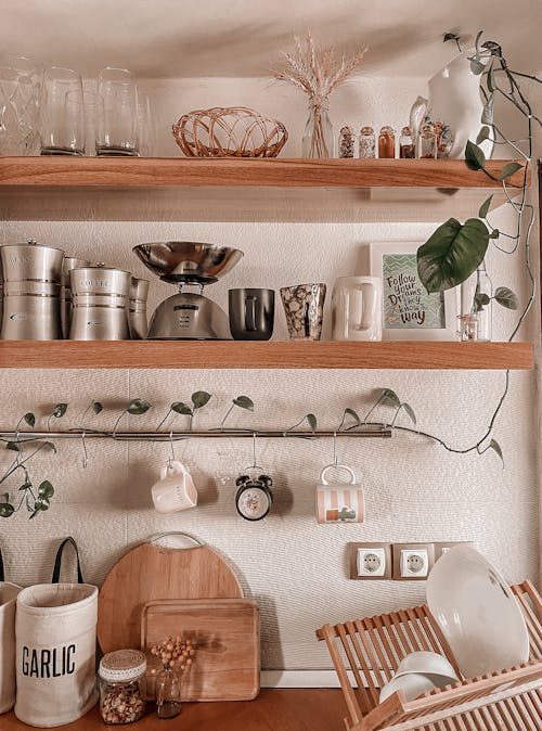 Kitchenware on Wooden Shelves in Kitchen