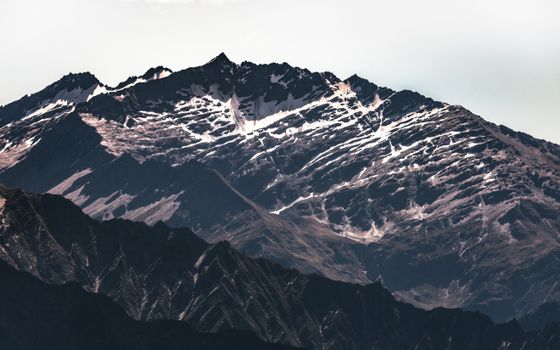 Breathtaking view of snow-capped mountains in New Zealand's Southern Alps.