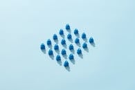 Photo of Meeples on a Blue Surface