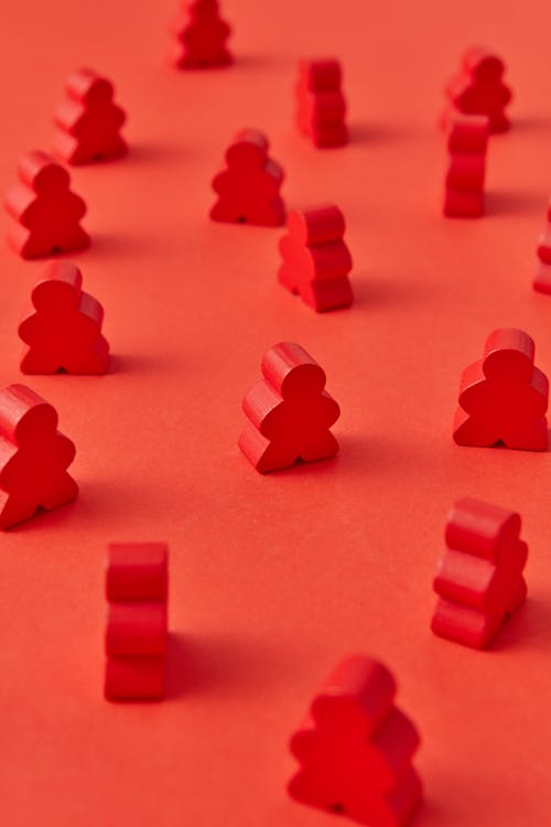 Free Photo of Red Meeple Pieces Stock Photo