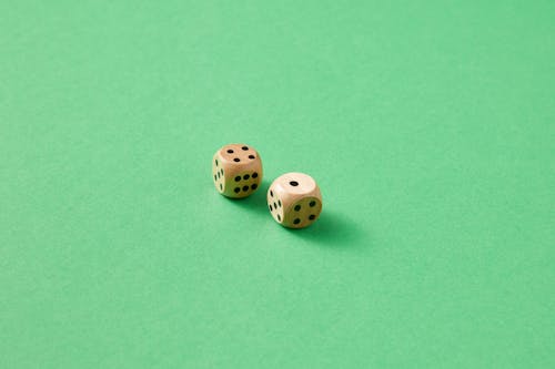 Close-Up Photo of Two Wooden Dice