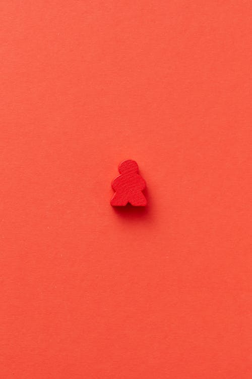Free Photo of a Red Meeple Piece Stock Photo