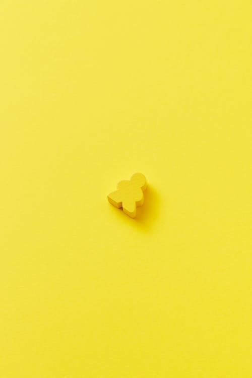 Photo of a Yellow Meeple Piece