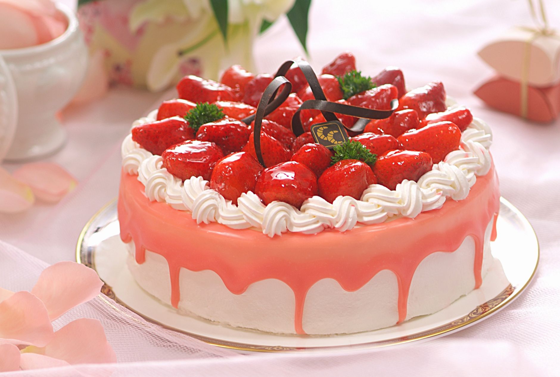 Strawberry Crunch Ice Cream Cake layered with frosting and crumbs
