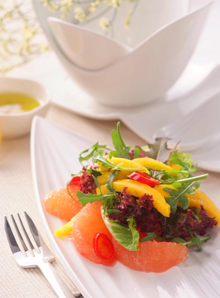 Photo Of A Salad With Grapefruits And Vegetables