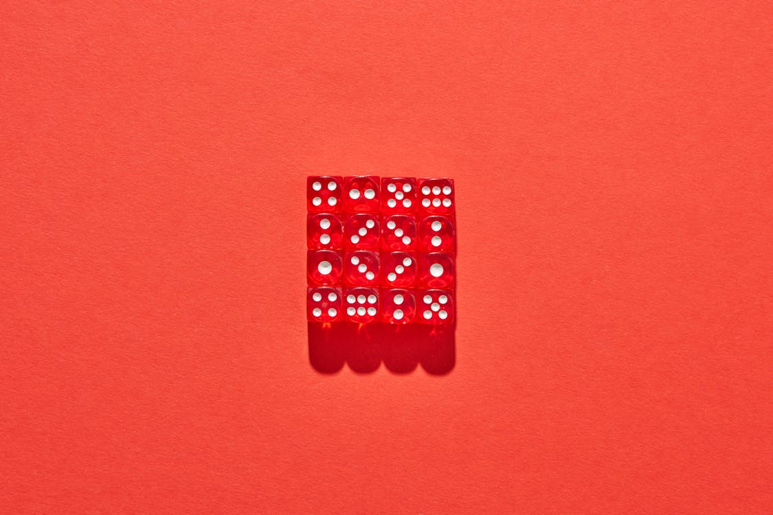 Cube with Dots on Red Surface