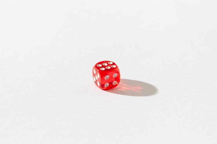 Red Dice On White Surface