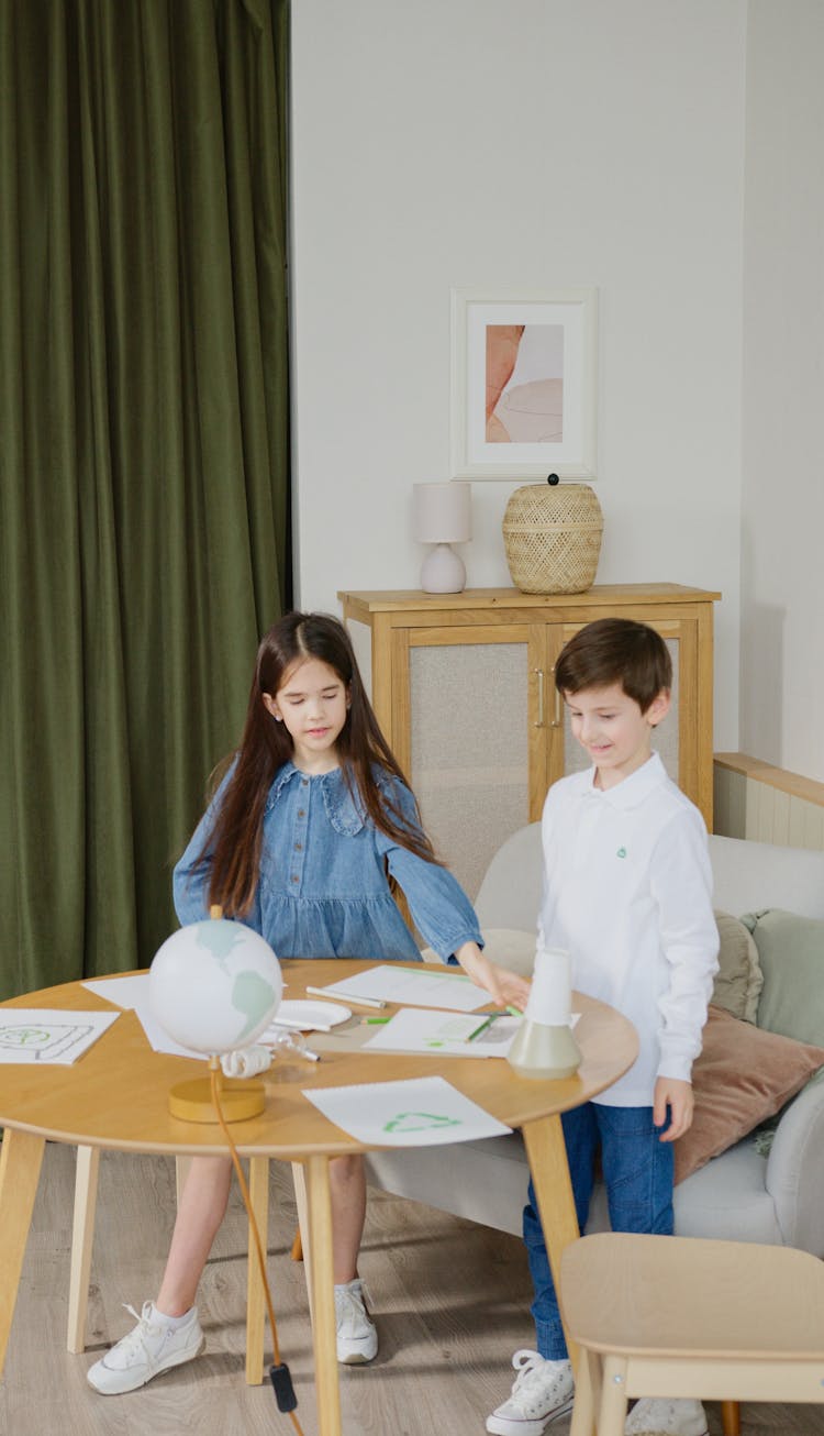 Young Boy And A Girl Studying Together