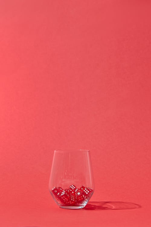 Red Dice in a Drinking Glass