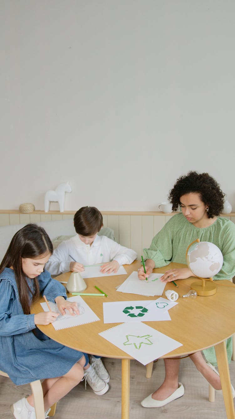 Woman Drawing On Paper With Kids