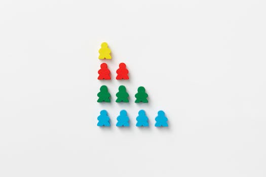 Vivid multi-colored game pieces arranged in a strategic pyramid on white background, offering a vibrant visual pattern.