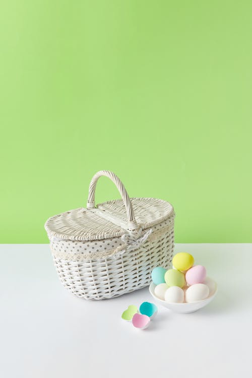 Basket and a Pile of Colorful Easter Eggs