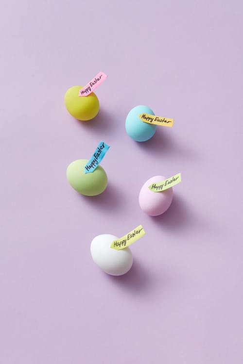 Colorful Easter Eggs with Notes Stuck to Them Saying Happy Easter