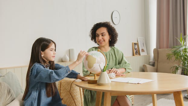 A child studies a globe with a teacher, engaging in an educational activity.