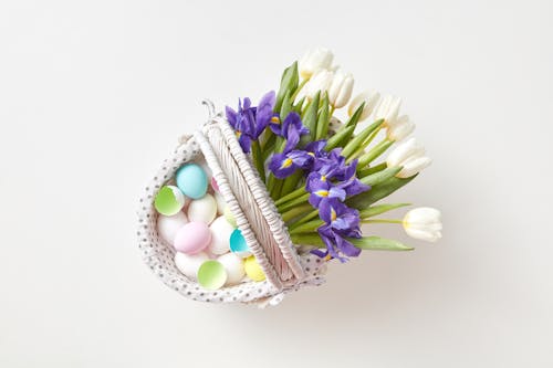 A Basket with Eggs and Flowers