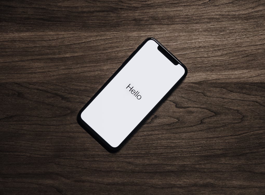 Free Black Iphone 7 on Brown Table Stock Photo