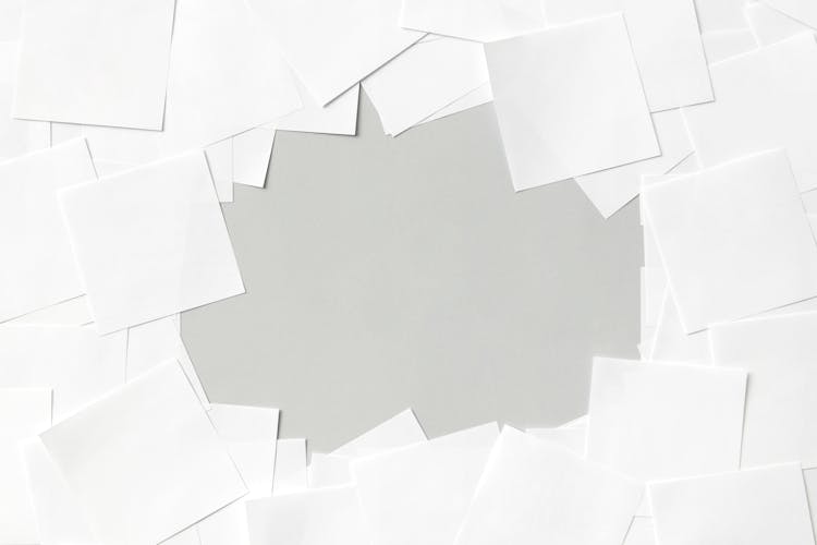 Overhead Shot Of Blank White Paper Sheets