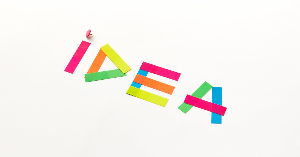 Creative concept with colorful paper cutouts spelling 'IDEA' against a white background.