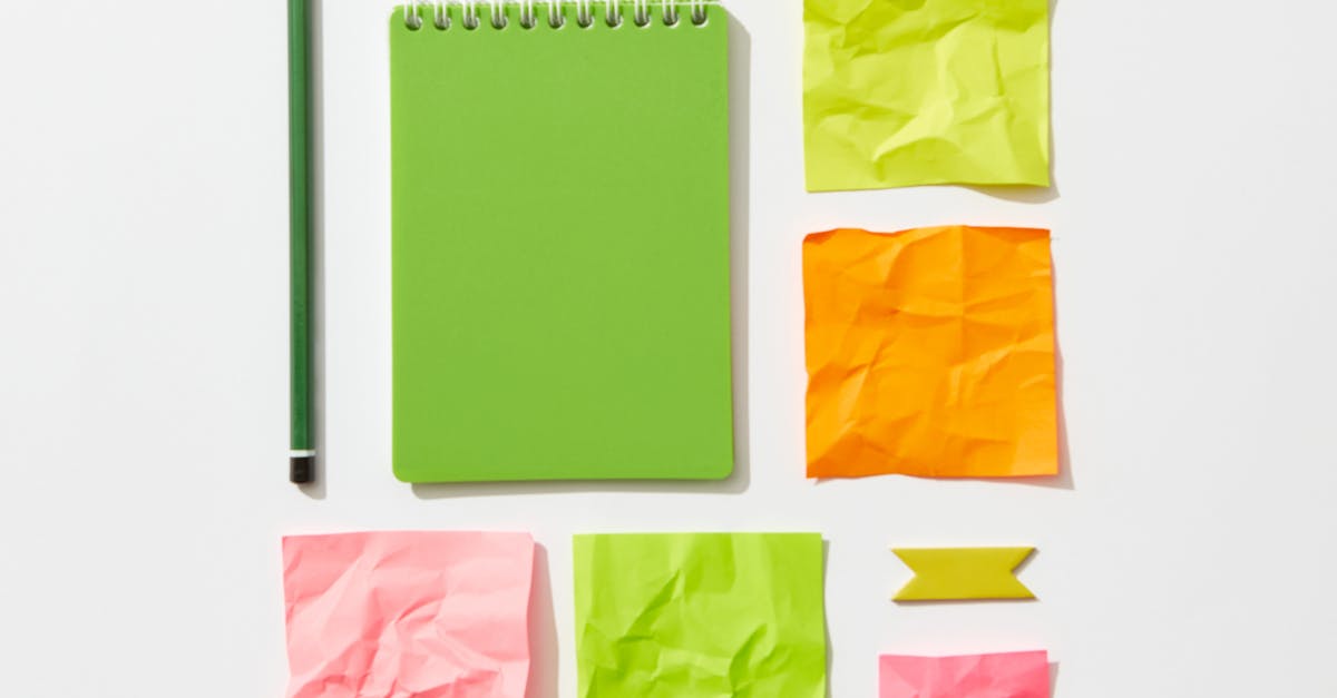 Crumpled Sticky Notes and Spiral Notepad Near the Pencil · Free Stock Photo