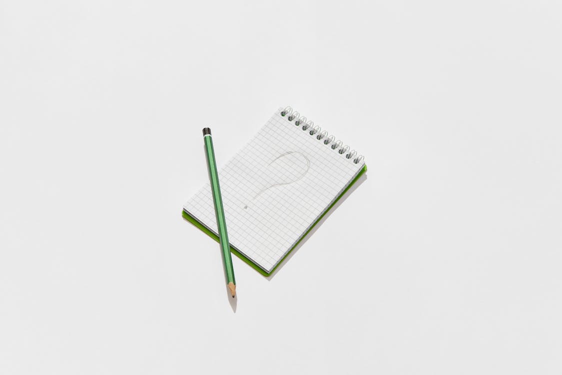 A Notepad with a Question Mark Drawing