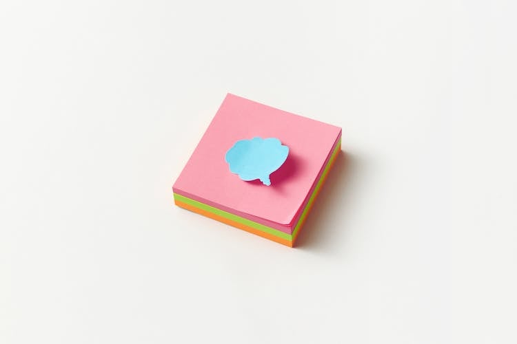 A Cloud Speech Bubble On A Sticky Note Pad