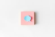 A Blue Cloud Speech Bubble on a Pink Sticky Note