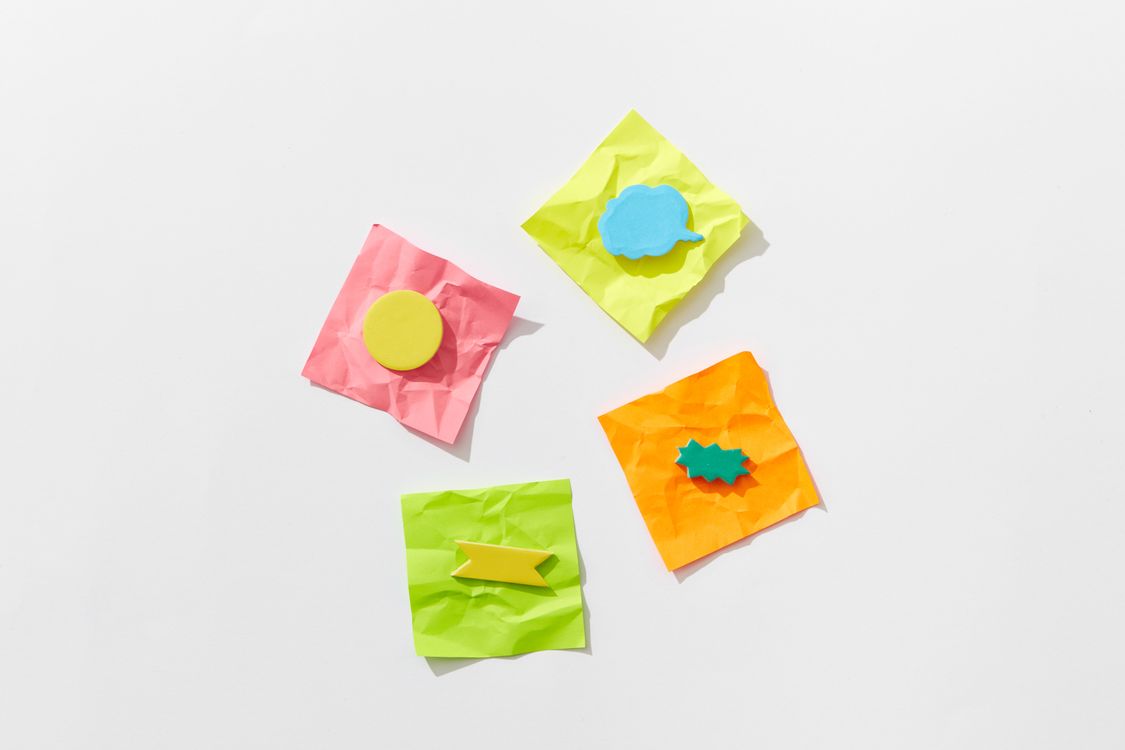 Assorted Speech Bubbles on Crumpled Sticky Notes · Free Stock Photo