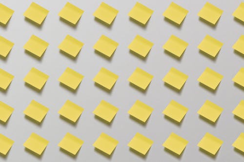 Yellow Sticky Note on White Surface