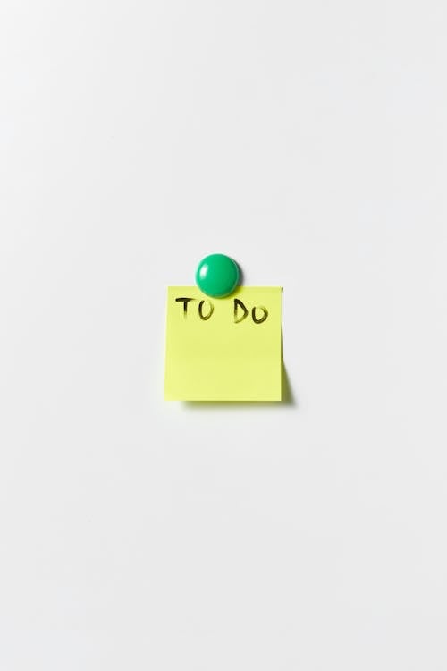 Free A To Do Note Written on a Post It with Magnet Stock Photo