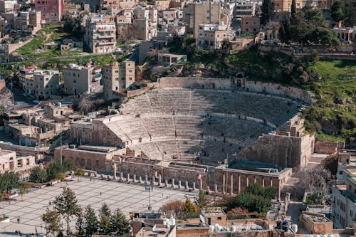 Free Aerial View of the Ruins of the Ancient Roman Amphitheatre in Amman, Jordan Stock Photo