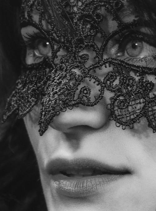 Free Grayscale Photo of Woman With Black Lace Floral Face Mask Stock Photo