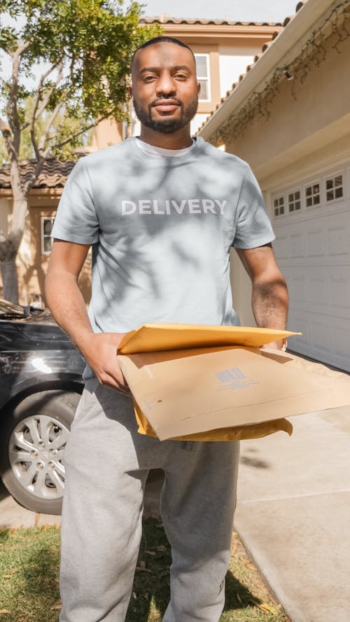 Free 
A Man Delivering Packages Stock Photo