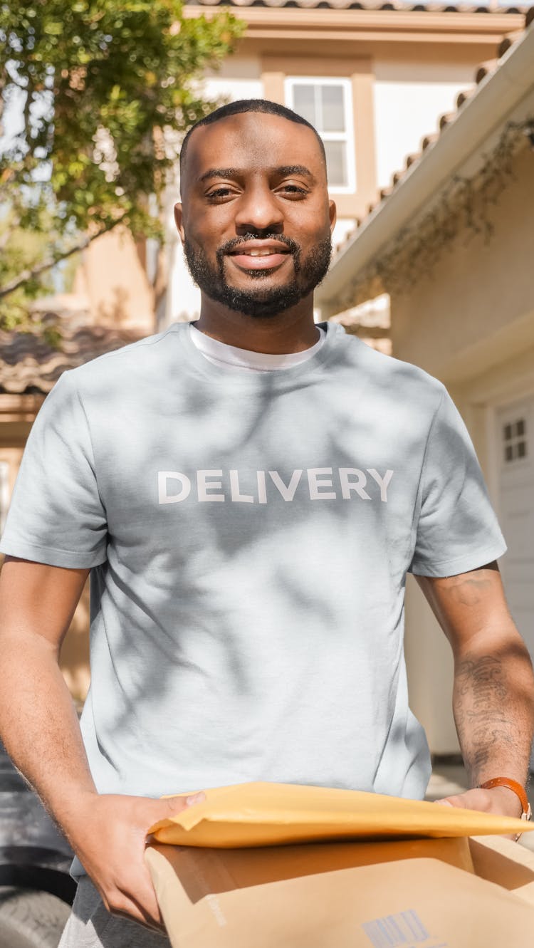 A Delivery Man Carrying Packages