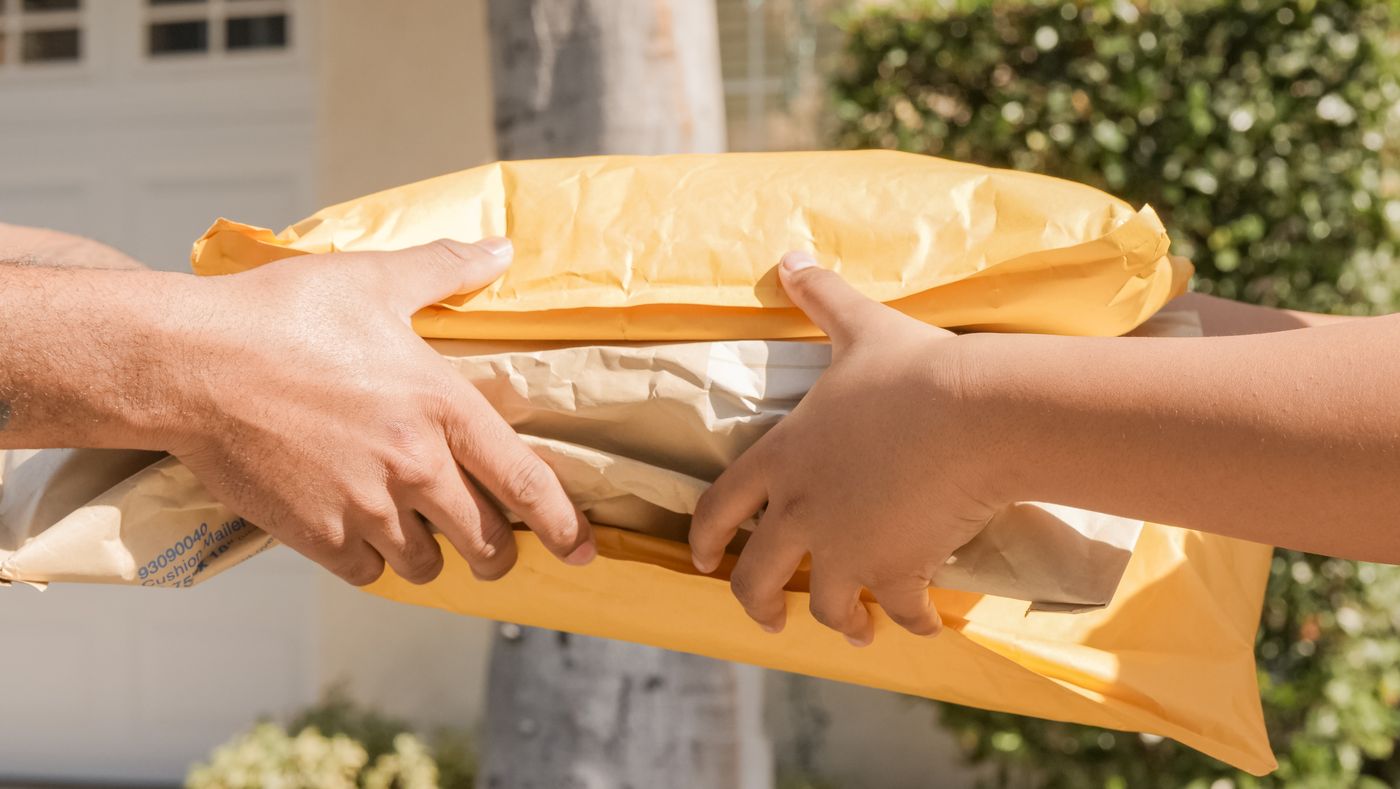 Person handing over delivery packages