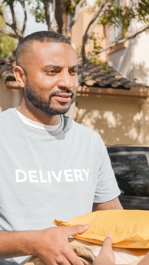 Delivery Man in Gray Shirt Giving the Order 