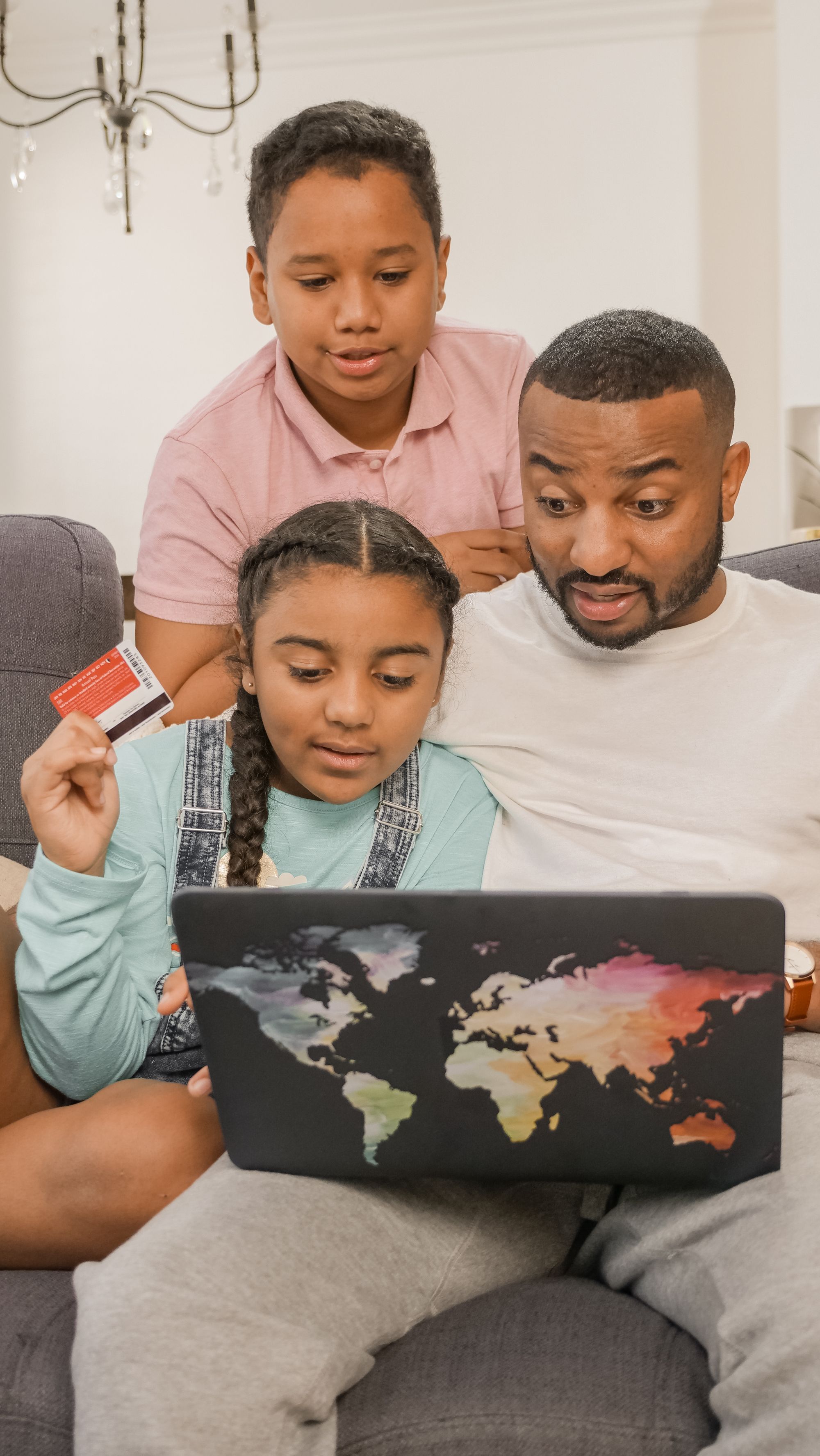 Family using a laptop for financial planning