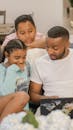 Father and Children Sitting on the Couch