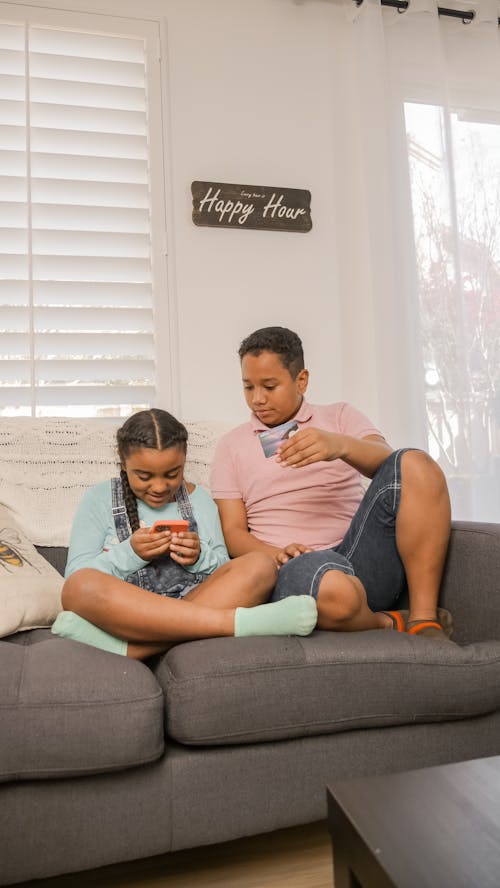 Free Kids Sitting on the Couch Stock Photo
