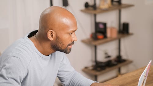 Side Profile of a Man Wearing a Gray Long Sleeve Shirt