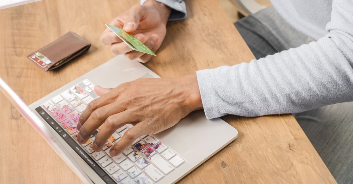 A Person Inputting Card Details on the Laptop · Free Stock Photo